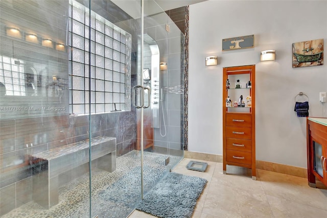 4060 SW 152nd Ave, Miramar, FL 33027 - bathroom with baseboards, tile patterned flooring, a stall shower, and vanity
