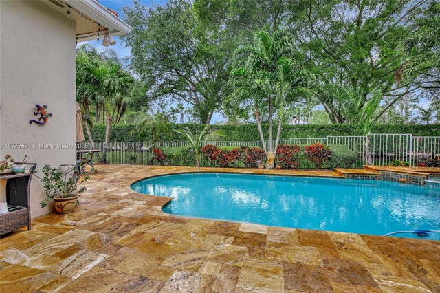 4060 SW 152nd Ave, Miramar, FL 33027 - view of swimming pool featuring a fenced in pool, a patio area, and a fenced backyard