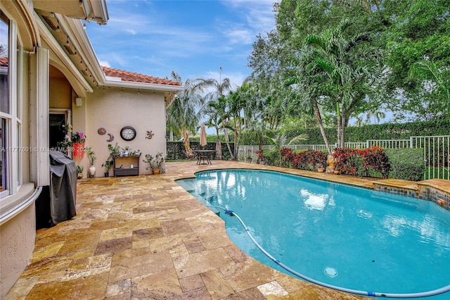 4060 SW 152nd Ave, Miramar, FL 33027 - view of pool with a fenced backyard, a grill, a fenced in pool, and a patio