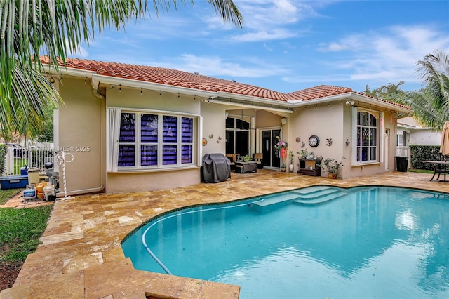 4060 SW 152nd Ave, Miramar, FL 33027 - back of property featuring a patio area, stucco siding, and fence