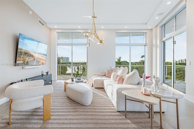 2001 Meridian Ave Unit 514, Miami Beach, FL 33139 - living area with a wealth of natural light, a notable chandelier, visible vents, and recessed lighting