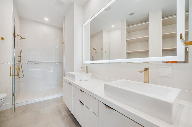 2001 Meridian Ave Unit 514, Miami Beach, FL 33139 - bathroom featuring toilet, a stall shower, a sink, and visible vents