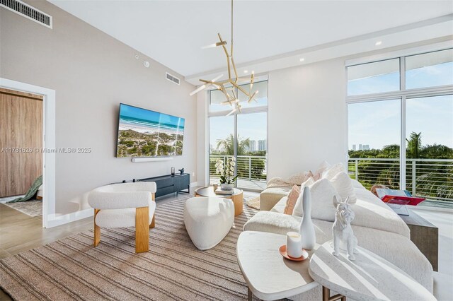 2001 Meridian Ave Unit 514, Miami Beach, FL 33139 - interior space featuring visible vents, plenty of natural light, and a notable chandelier