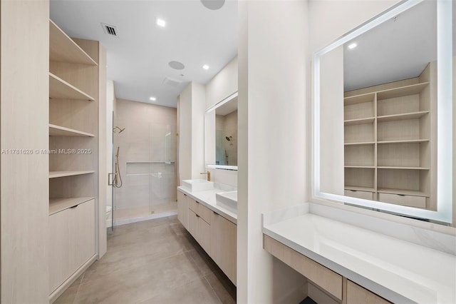 2001 Meridian Ave Unit 514, Miami Beach, FL 33139 - full bath featuring visible vents, built in shelves, recessed lighting, vanity, and a stall shower
