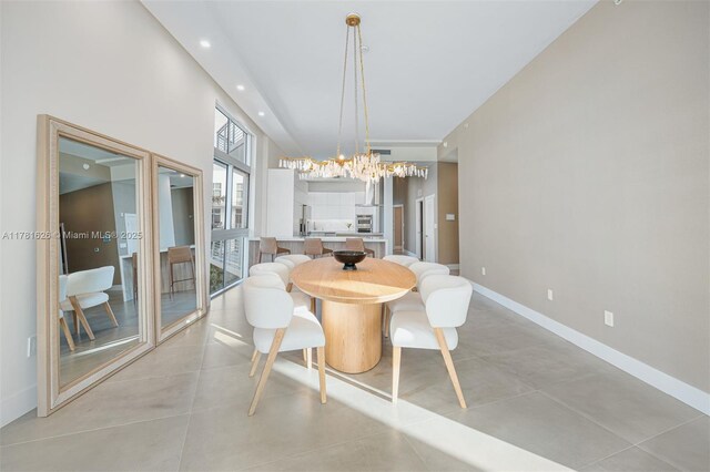 2001 Meridian Ave Unit 514, Miami Beach, FL 33139 - dining space featuring baseboards, recessed lighting, and an inviting chandelier