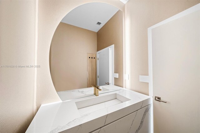2001 Meridian Ave Unit 514, Miami Beach, FL 33139 - bathroom featuring visible vents and vanity