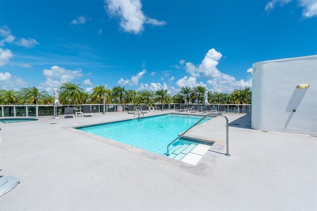 2001 Meridian Ave Unit 514, Miami Beach, FL 33139 - pool featuring a patio area, fence, and a hot tub