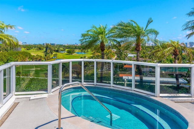 2001 Meridian Ave Unit 514, Miami Beach, FL 33139 - view of swimming pool with a hot tub