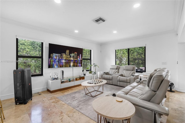 living room with baseboards, ornamental molding, visible vents, and recessed lighting