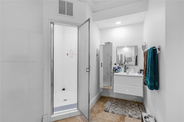 full bath featuring visible vents, baseboards, a shower stall, and vanity