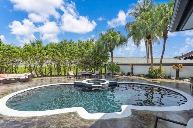 view of swimming pool with a patio area, an outdoor living space, a pool with connected hot tub, and fence