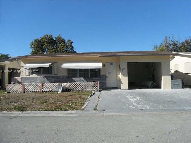 6855 NW 9th St, Margate, FL 33063 - view of front of house with concrete driveway, stucco siding, and an attached garage