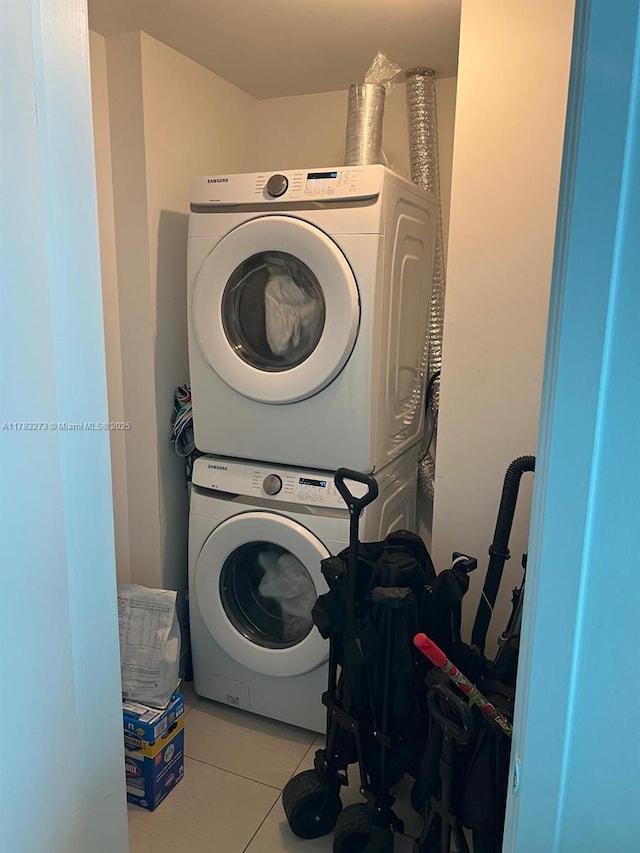 3301 NE 1st Ave Unit H1810, Miami, FL 33137 - laundry area with stacked washer / drying machine and tile patterned flooring