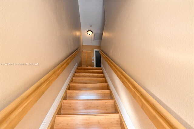 8390 NW 103rd St Unit 205H, Hialeah Gardens, FL 33016 - stairs featuring wood finished floors