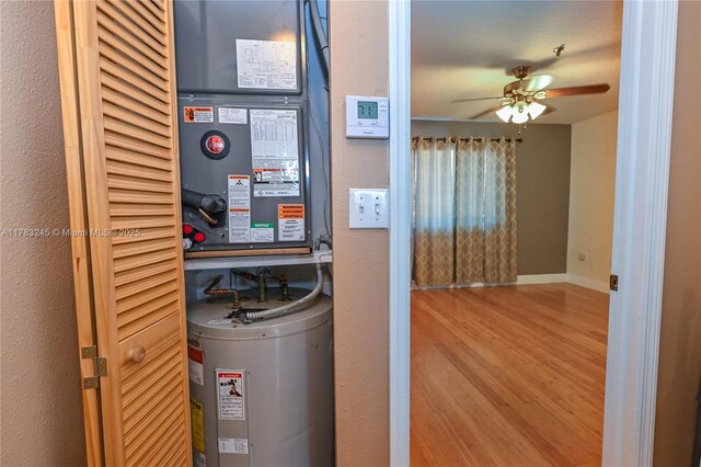 8390 NW 103rd St Unit 205H, Hialeah Gardens, FL 33016 - utility room featuring electric water heater