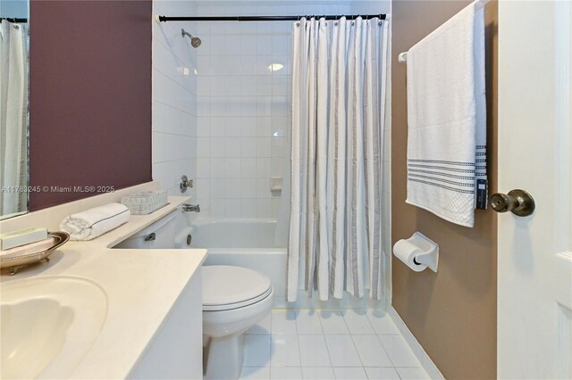8390 NW 103rd St Unit 205H, Hialeah Gardens, FL 33016 - full bathroom with shower / tub combo, baseboards, toilet, vanity, and tile patterned floors