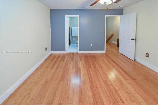8390 NW 103rd St Unit 205H, Hialeah Gardens, FL 33016 - spare room featuring light wood-style flooring, baseboards, a ceiling fan, and visible vents