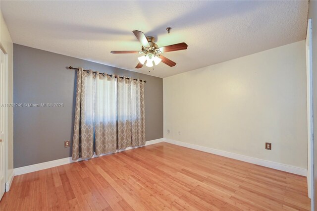 8390 NW 103rd St Unit 205H, Hialeah Gardens, FL 33016 - empty room featuring light wood-style flooring, baseboards, and a ceiling fan