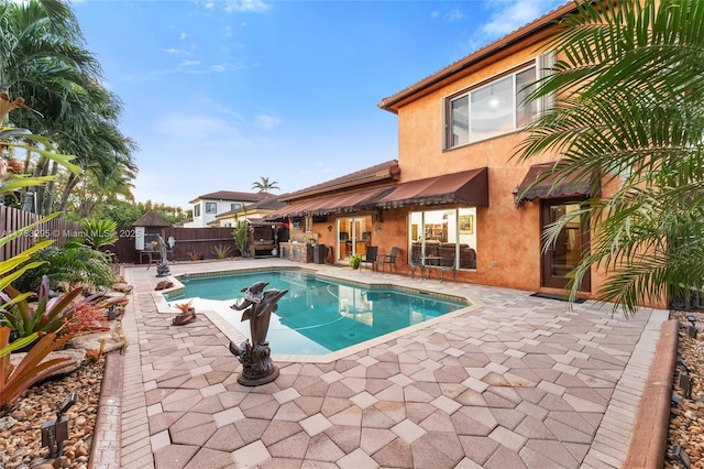 view of swimming pool with a patio area, a fenced backyard, and a fenced in pool