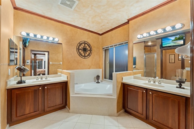 full bathroom with a stall shower, ornamental molding, visible vents, a sink, and tile patterned floors