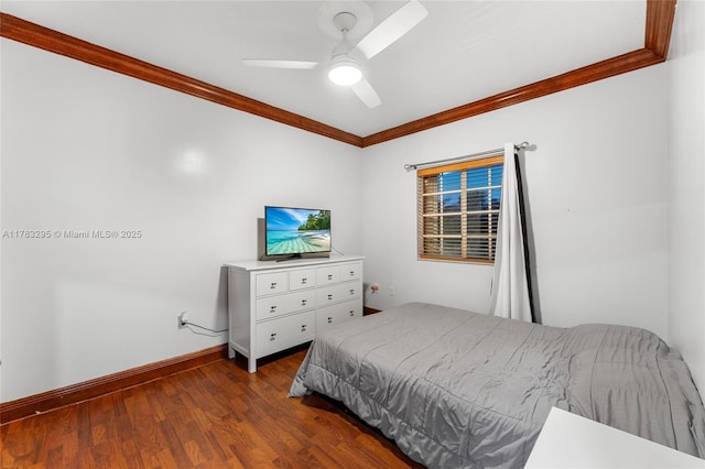 bedroom with ceiling fan, baseboards, crown molding, and wood finished floors