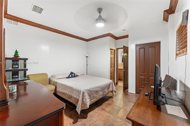 tiled bedroom with visible vents, ornamental molding, a ceiling fan, and ensuite bathroom