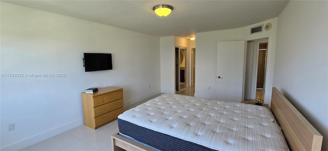 2801 NE 183rd St Unit 714W, Aventura, FL 33160 - bedroom with baseboards, a closet, and light tile patterned flooring