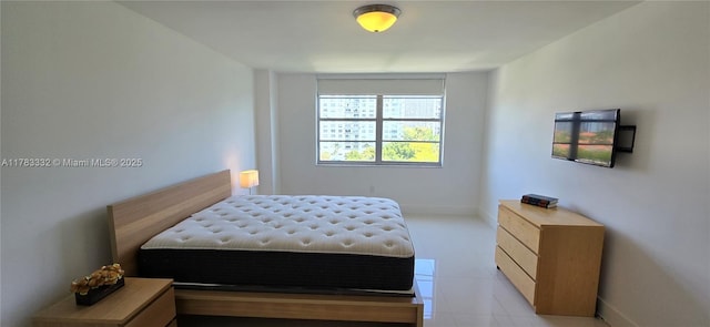 2801 NE 183rd St Unit 714W, Aventura, FL 33160 - bedroom with baseboards and light tile patterned floors