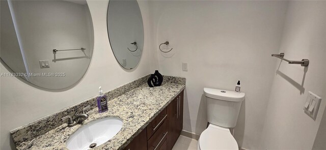 2801 NE 183rd St Unit 714W, Aventura, FL 33160 - bathroom with vanity, toilet, baseboards, and tile patterned flooring