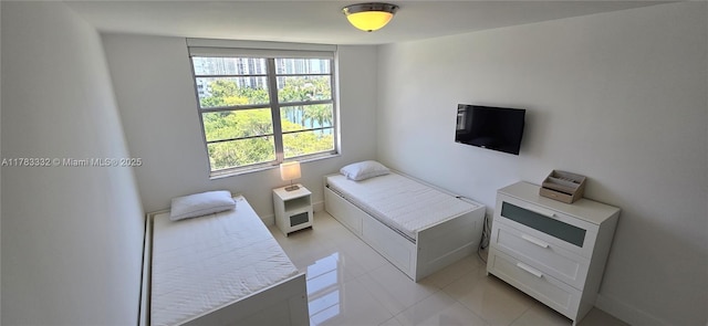 2801 NE 183rd St Unit 714W, Aventura, FL 33160 - bedroom featuring light tile patterned floors and baseboards