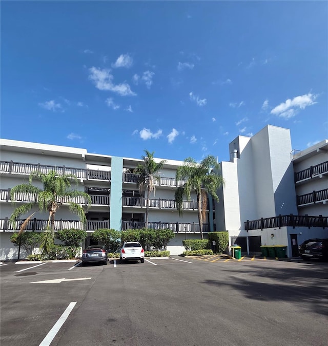 view of property featuring uncovered parking
