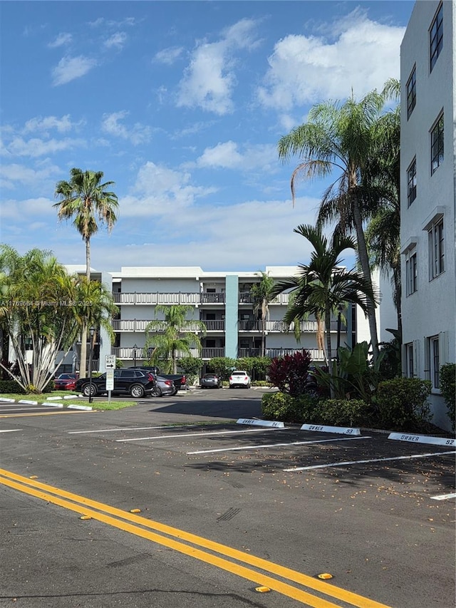 view of property with uncovered parking