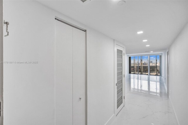 3625 N Country Club Dr Unit 2310, Aventura, FL 33180 - hallway featuring light marble finish floors, recessed lighting, and baseboards