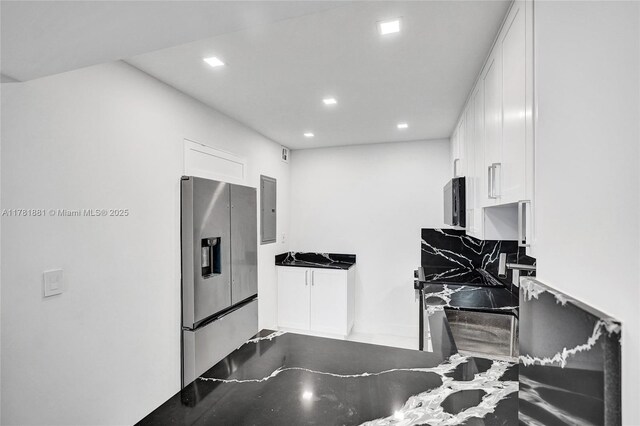 3625 N Country Club Dr Unit 2310, Aventura, FL 33180 - kitchen with stainless steel fridge, white cabinets, recessed lighting, and electric panel