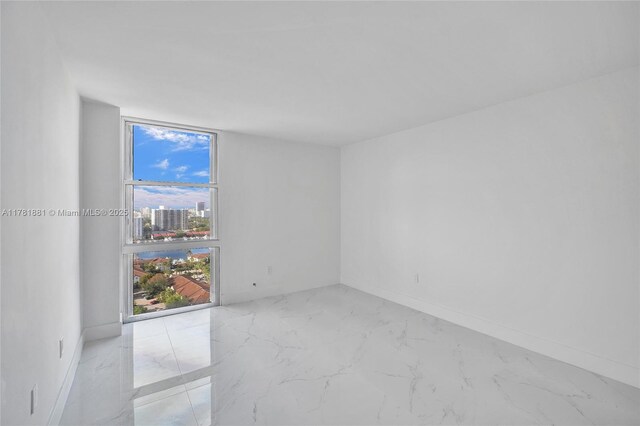3625 N Country Club Dr Unit 2310, Aventura, FL 33180 - spare room with light marble finish flooring and baseboards