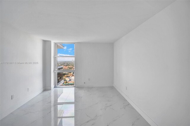 3625 N Country Club Dr Unit 2310, Aventura, FL 33180 - empty room featuring light marble finish floors and baseboards