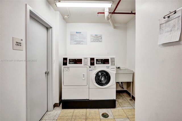 3625 N Country Club Dr Unit 2310, Aventura, FL 33180 - community laundry with washing machine and dryer and baseboards