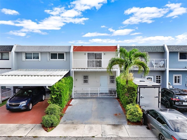 1845 W 73rd Pl Unit 1845, Hialeah, FL 33014 - townhome / multi-family property featuring roof with shingles, mansard roof, and stucco siding