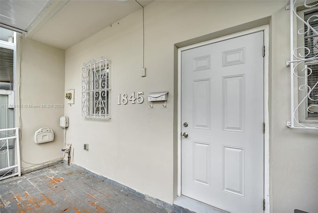 1845 W 73rd Pl Unit 1845, Hialeah, FL 33014 - doorway to property featuring stucco siding