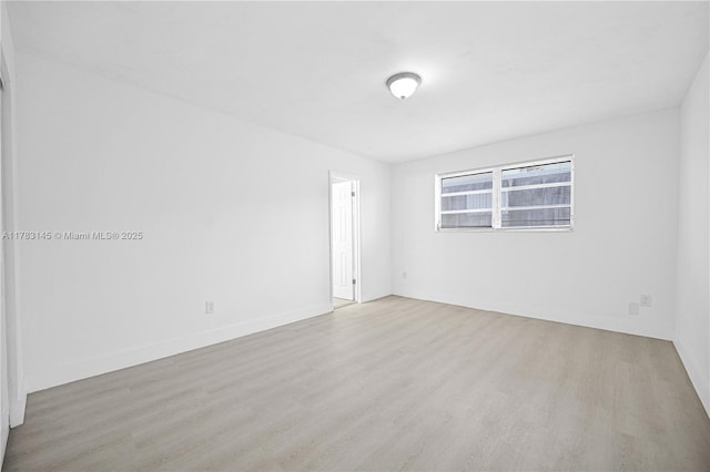 1845 W 73rd Pl Unit 1845, Hialeah, FL 33014 - spare room featuring wood finished floors and baseboards