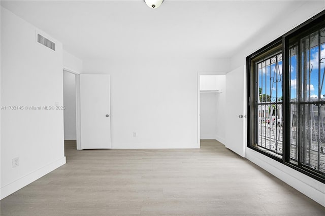 1845 W 73rd Pl Unit 1845, Hialeah, FL 33014 - empty room with wood finished floors and baseboards