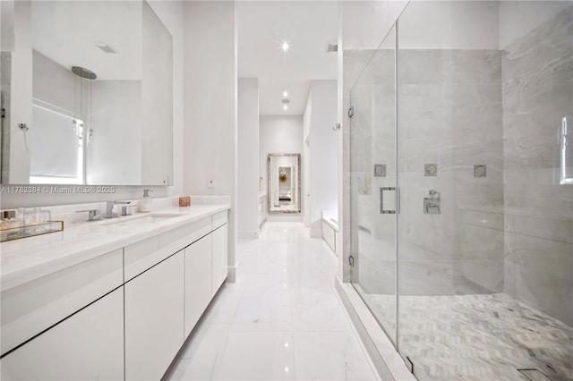 full bath featuring baseboards, a shower stall, marble finish floor, and vanity