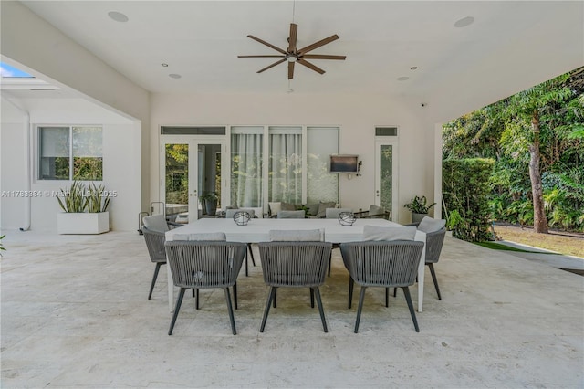 view of patio featuring a ceiling fan and outdoor dining area