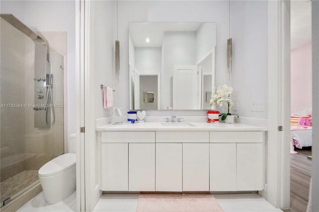 full bathroom with ensuite bathroom, toilet, a shower stall, and vanity