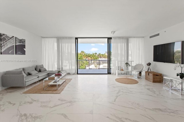 160 Isle Of Venice Dr Unit 403, Fort Lauderdale, FL 33301 - living area with a wall of windows and marble finish floor