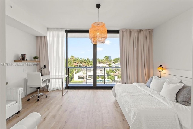 160 Isle Of Venice Dr Unit 403, Fort Lauderdale, FL 33301 - bedroom with floor to ceiling windows and wood finished floors
