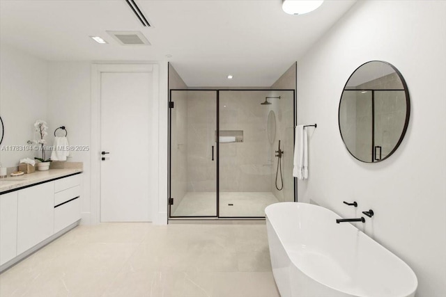 160 Isle Of Venice Dr Unit 403, Fort Lauderdale, FL 33301 - bathroom featuring a shower stall, vanity, and a freestanding bath