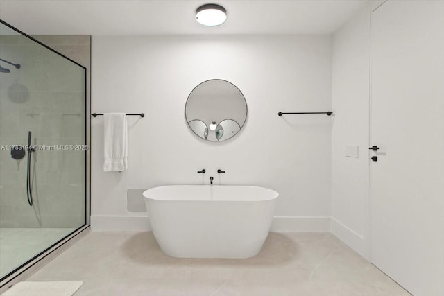 160 Isle Of Venice Dr Unit 403, Fort Lauderdale, FL 33301 - full bathroom featuring a freestanding bath, tiled shower, and baseboards