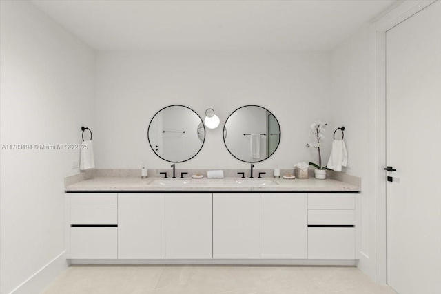 160 Isle Of Venice Dr Unit 403, Fort Lauderdale, FL 33301 - full bathroom featuring tile patterned floors, double vanity, and a sink