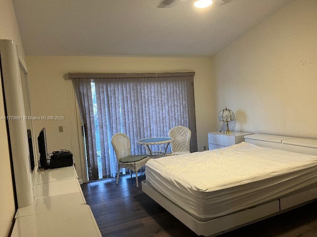 bedroom with dark wood finished floors